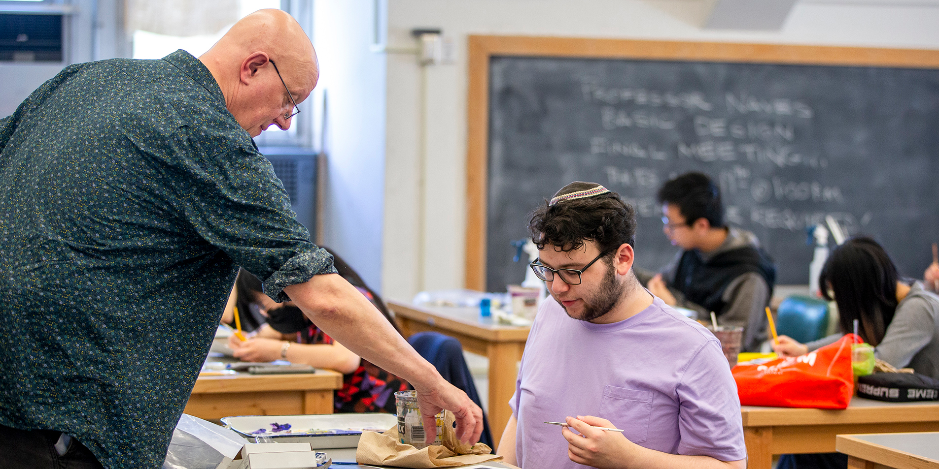 students and a professor in a classroom